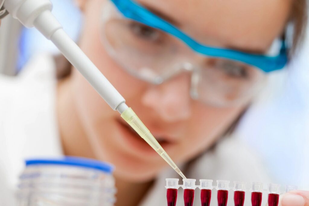 Scientist reviewing potency assay development data from a characterized mammalian cell bank